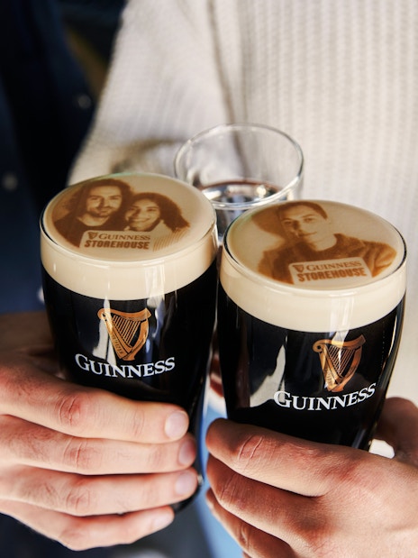 Guests enjoying personalized Stouties at Guinness Storehouse, Dublin.
