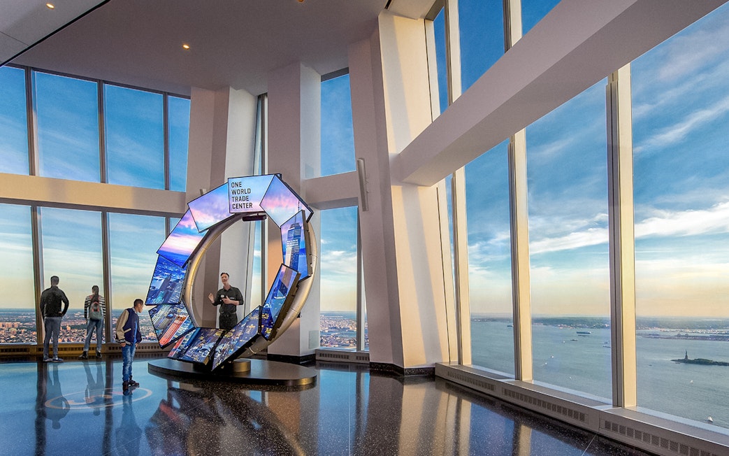 One World Observatory view of New York City skyline with City Pulse exhibit.