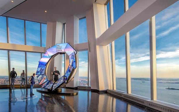 One World Observatory view of New York City skyline with City Pulse exhibit.