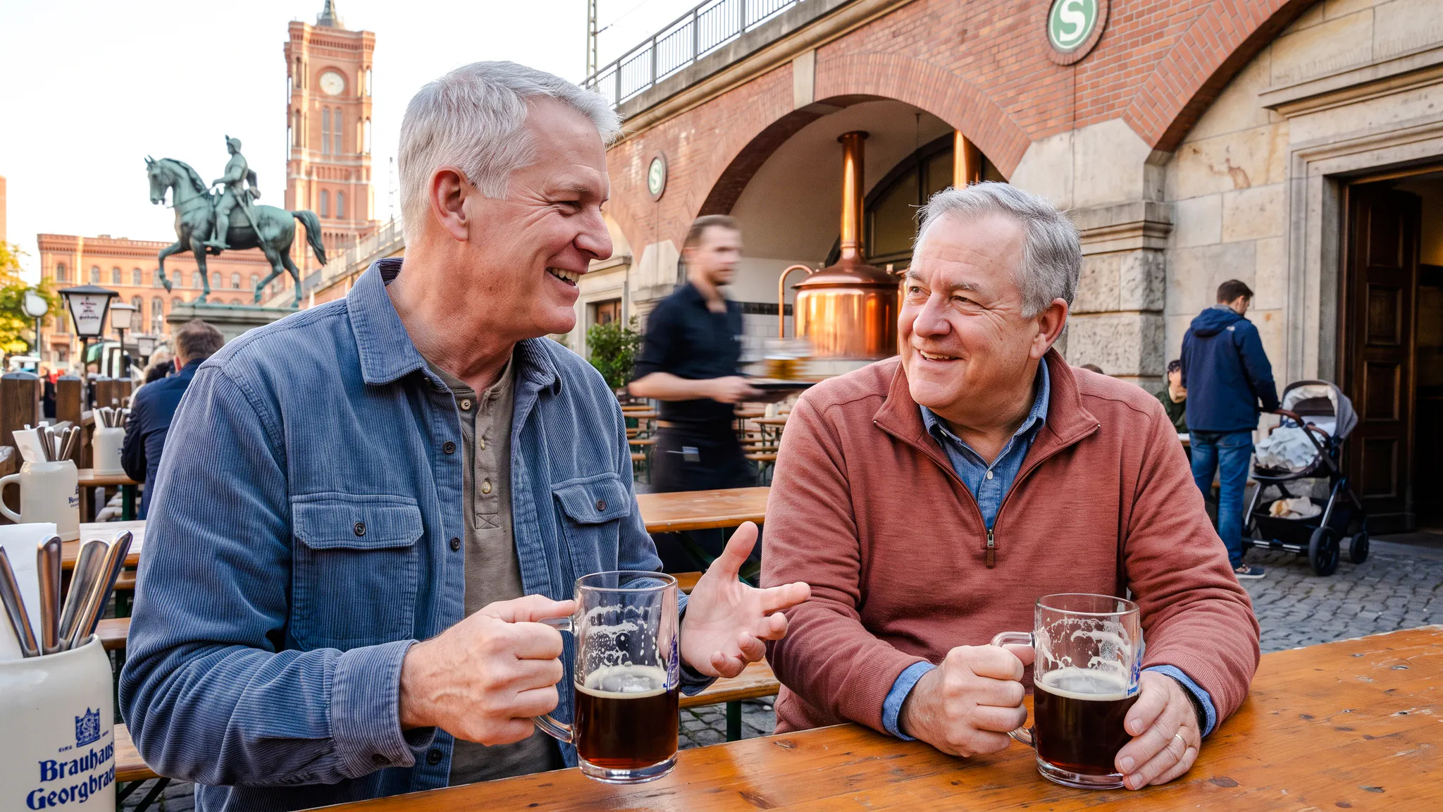 Men enjoying beer at an outdoor table during Berlin's Oktoberfest Breweries walking tour.
