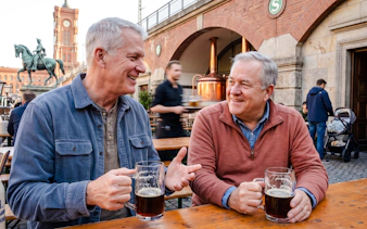 Men enjoying beer at an outdoor table during Berlin's Oktoberfest Breweries walking tour.