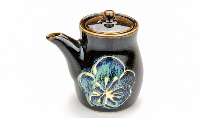 Japanese ceramic teapot with floral design.