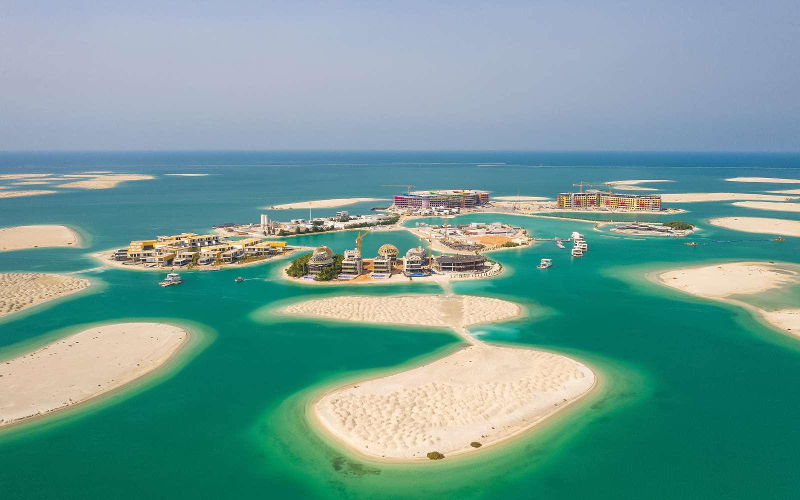Aerial view of The World Islands, Jumeirah, Dubai, showcasing luxury villas and turquoise waters.