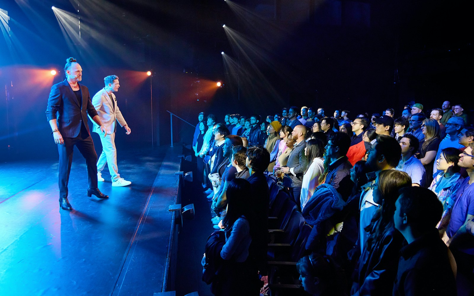 Performers on stage engaging with audience during Stalker show.
