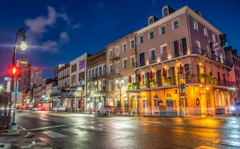 Historic French Quarter street at night, New Orleans, part of the Phantom Ballerina city exploration game.