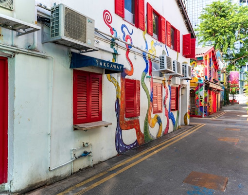 Colorful street art and boutique shops on Haji Lane, Singapore.