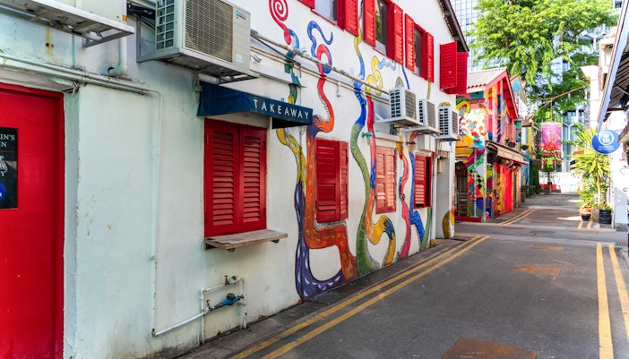 Colorful street art and boutique shops on Haji Lane, Singapore.