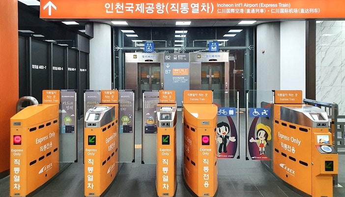 AREX Express train at Incheon Airport platform, South Korea, ready for passenger boarding.
