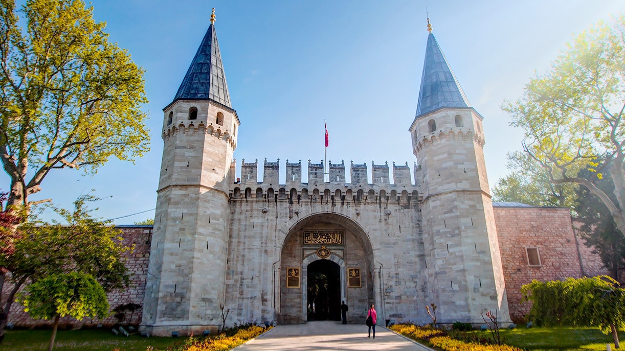 Topkapi Palace courtyard with tourists exploring in Istanbul.