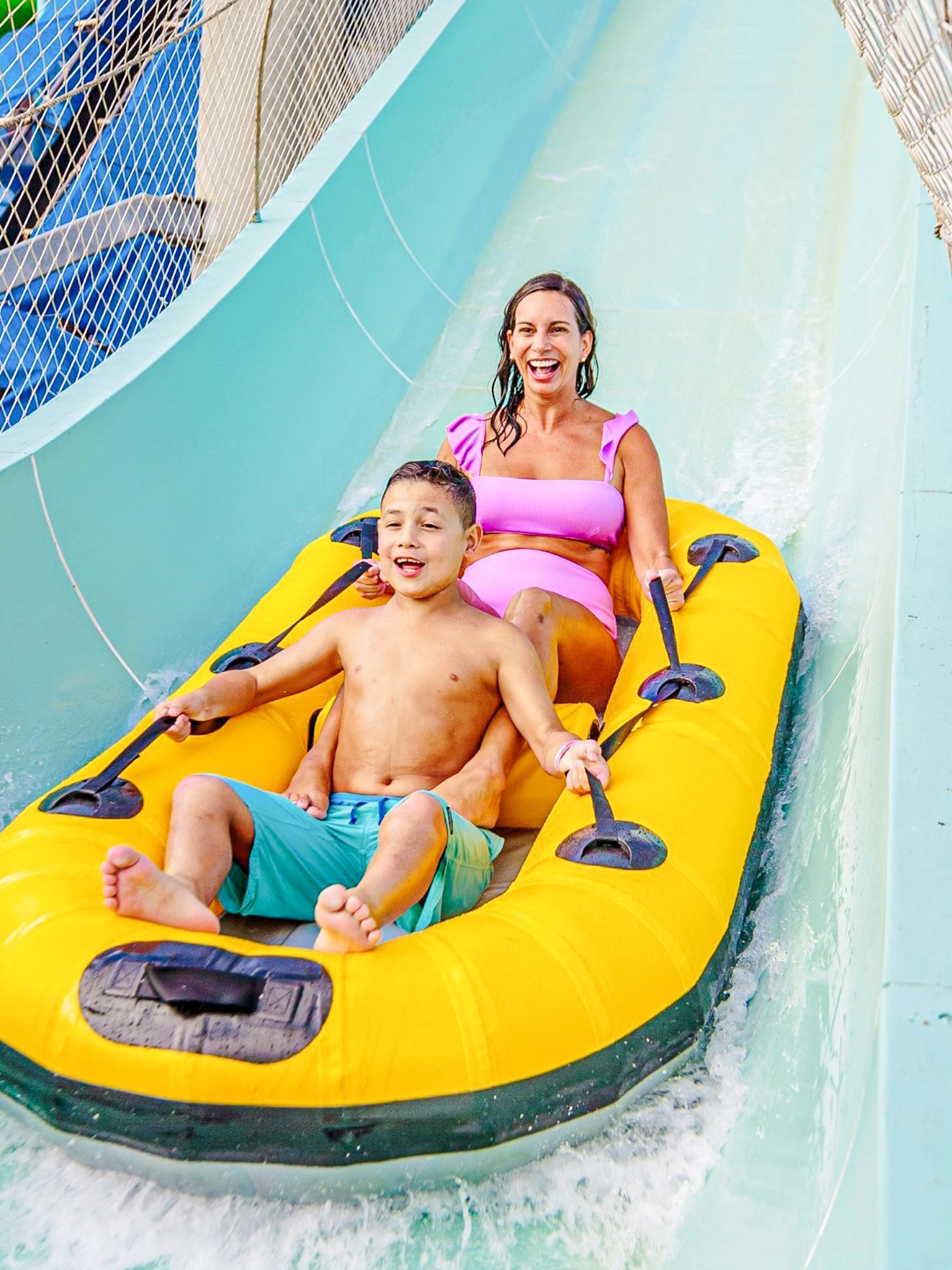Two people enjoying the Master Blaster water ride at Schlitterbahn New Braunfels.