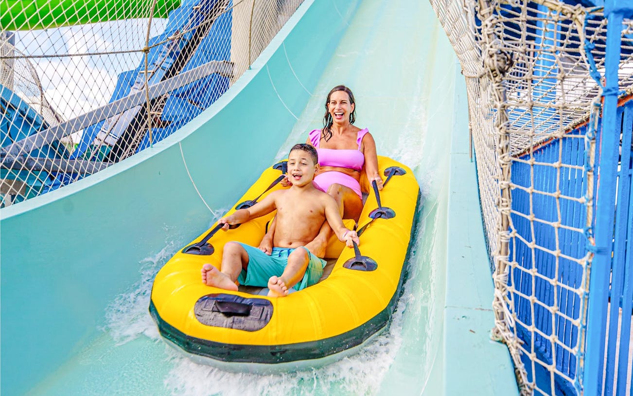 Two people enjoying the Master Blaster water ride at Schlitterbahn New Braunfels.