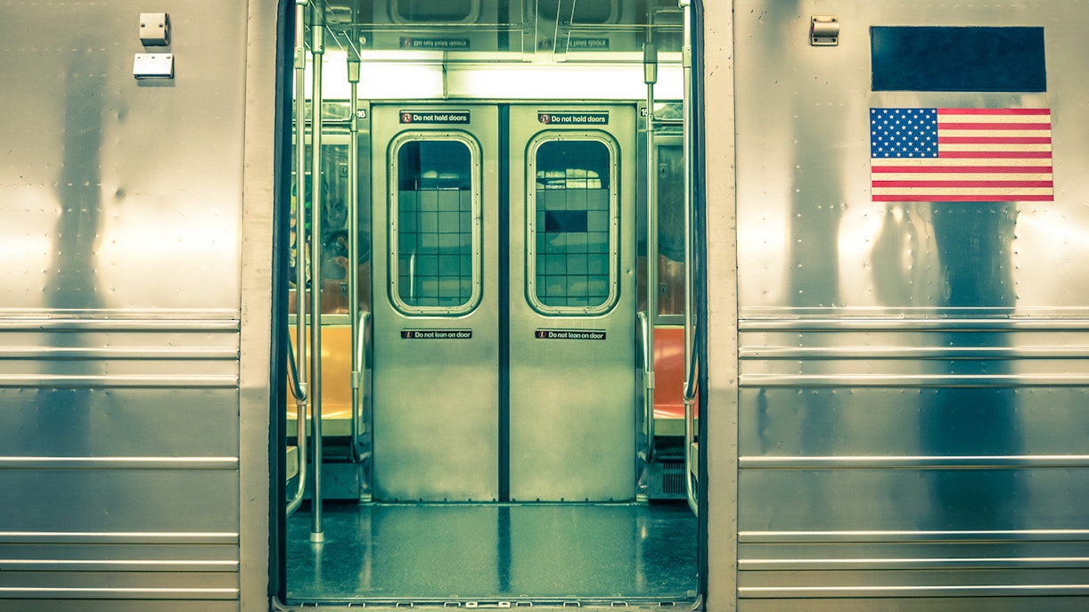 Subway train doors open, interior view, New York City.