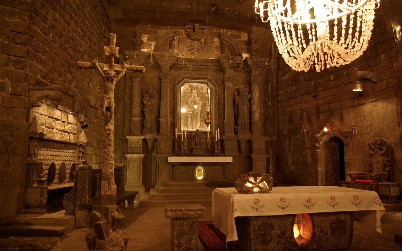 Wieliczka Salt Mine chapel interior with altar and salt carvings, Krakow tour.