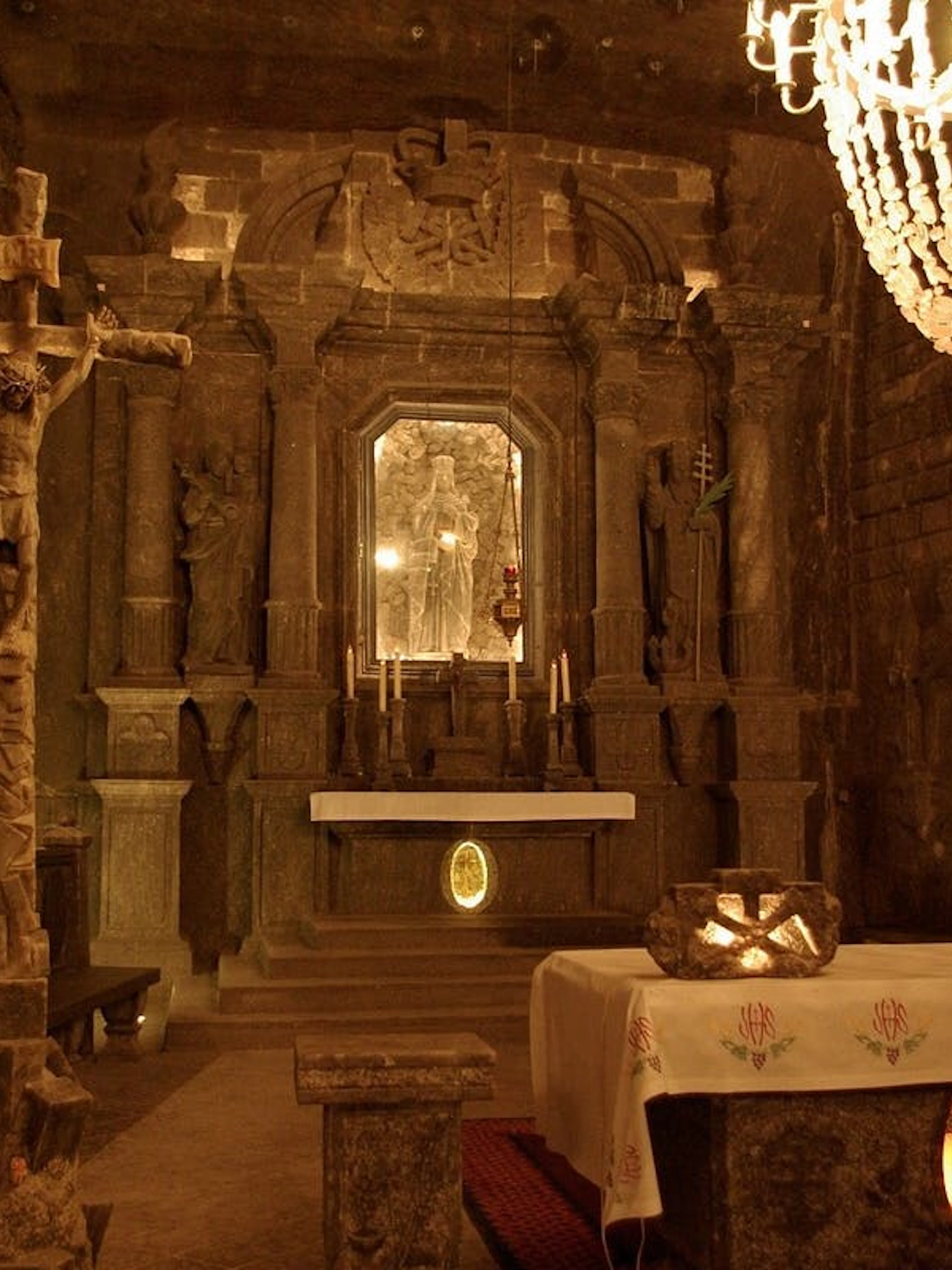 Wieliczka Salt Mine chapel interior with altar and salt carvings, Krakow tour.