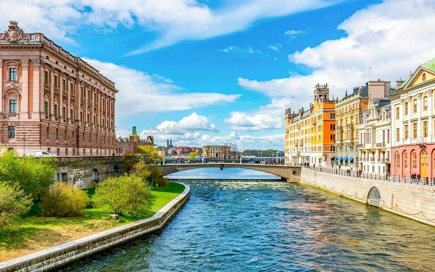 Canal view near the Royal Palace in Stockholm, with historic buildings lining the water.