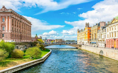 Canal view near the Royal Palace in Stockholm, with historic buildings lining the water.