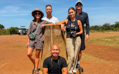 Group of tourists at the Kenya-Tanzania border during a Masai Mara Safari.