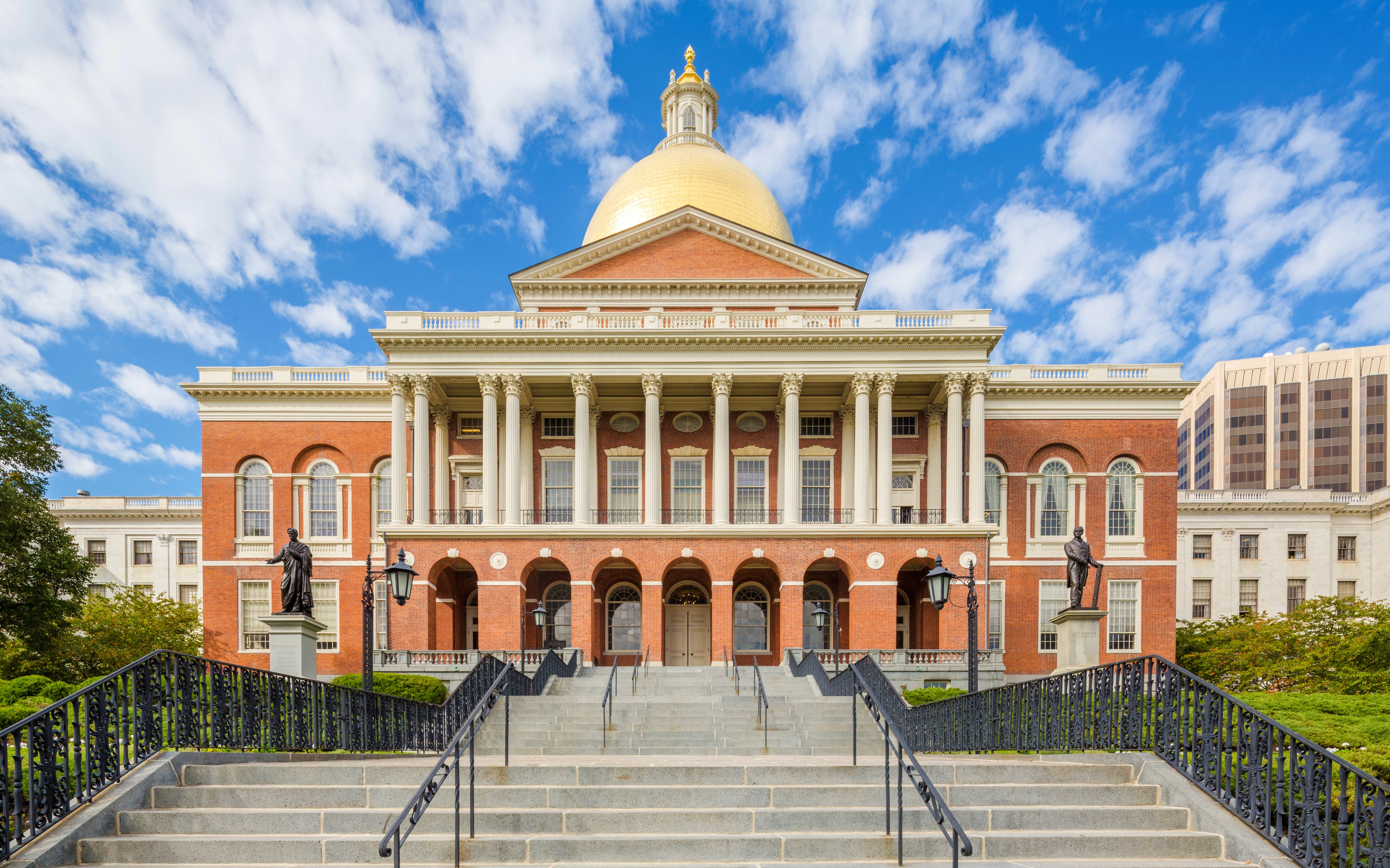 Massachusetts State House with golden dome and columns in Boston.