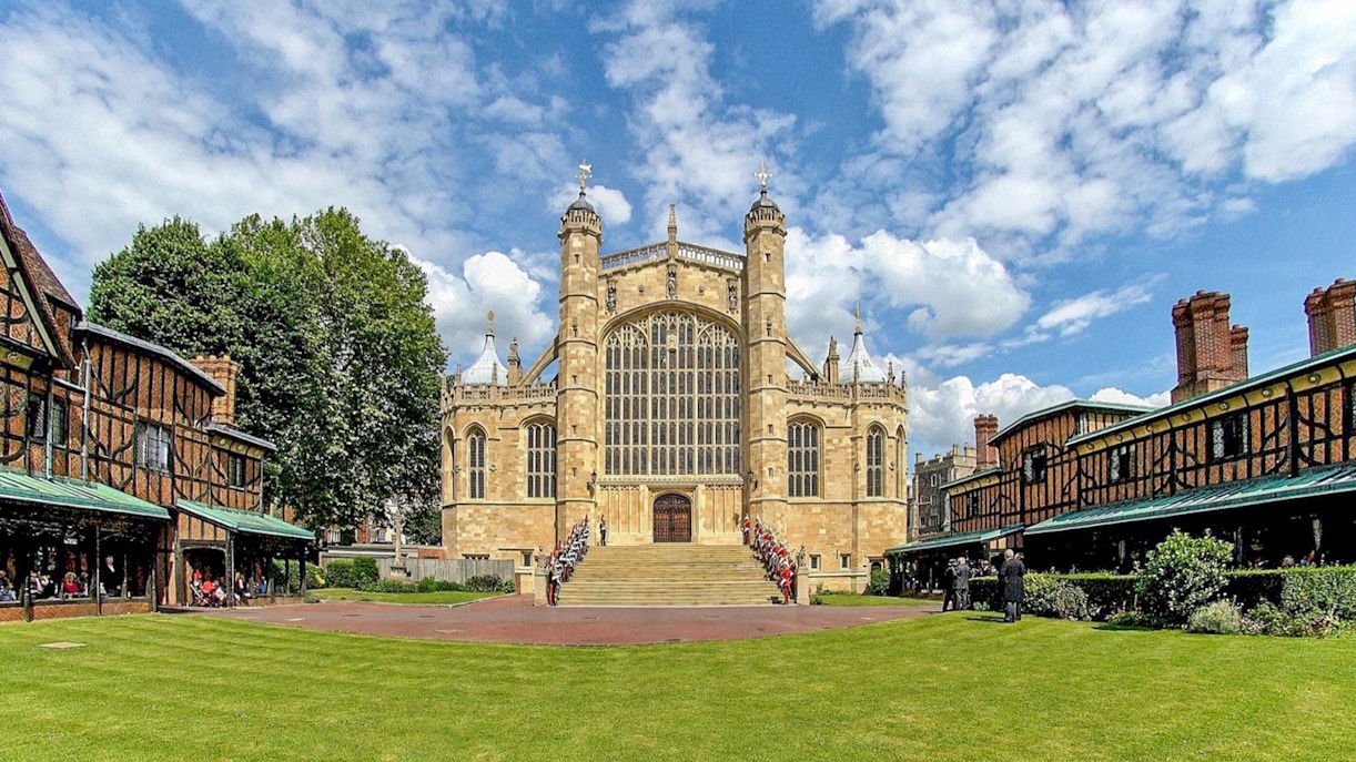 St George's Chapel at Windsor Castle with ceremonial guards on steps.