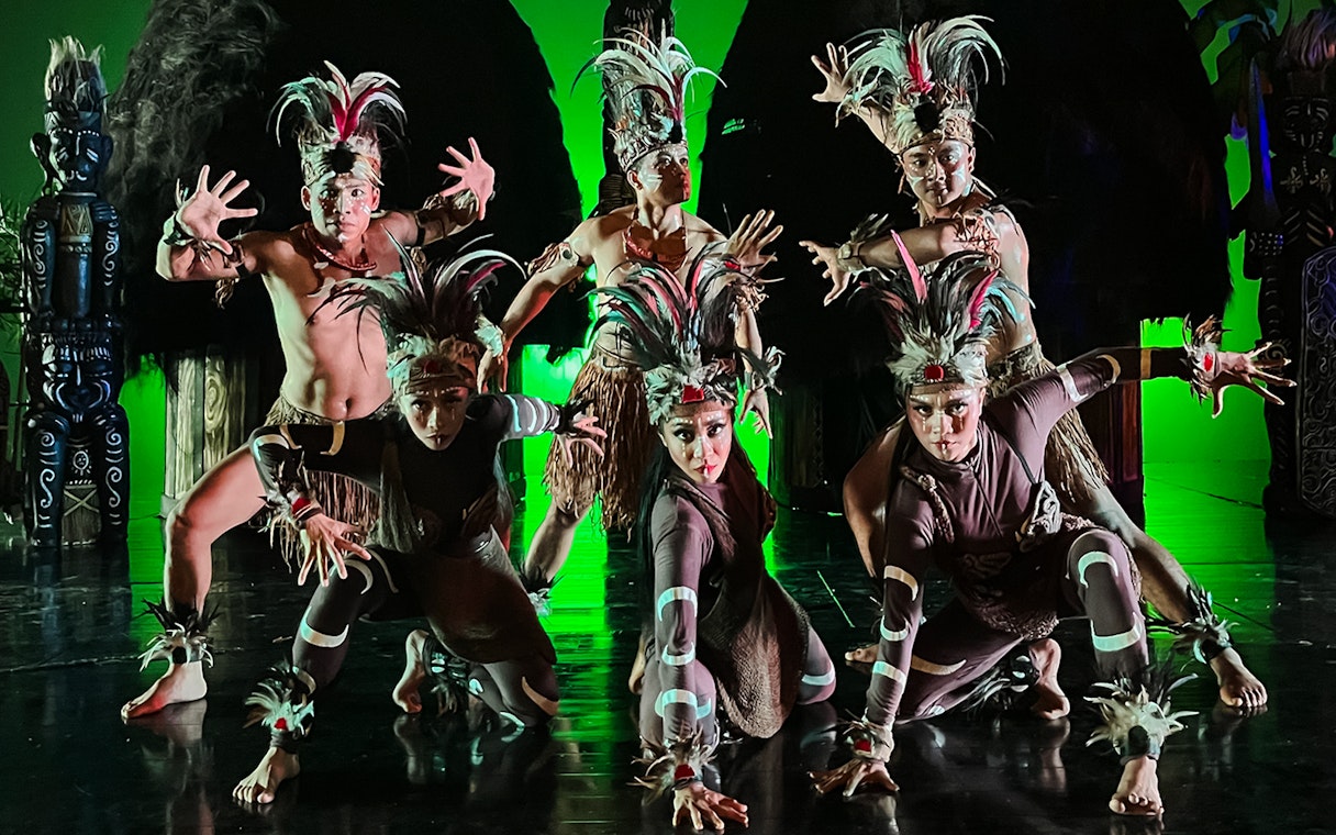 Performers in traditional costumes during the Devdan Show in Bali, showcasing cultural dance.