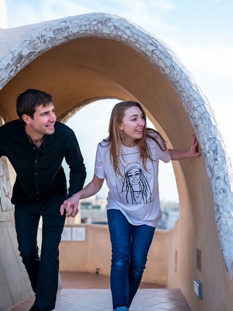 Visitors exploring the unique architecture of La Pedrera-Casa Milà terrace in Barcelona.