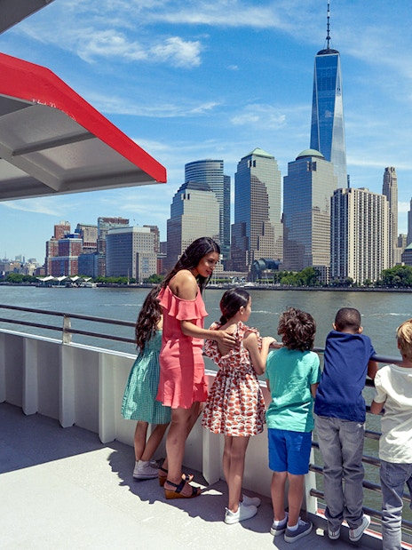Cruise passengers view New York City skyline, including One World Trade Center, on Circle Line Liberty Midtown Cruise.