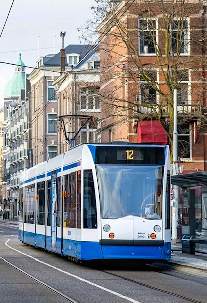 Tram number 12 on a street in Amsterdam, Netherlands, part of the GVB public transport system.