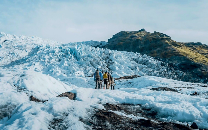 Guests exploring ice maze and glacier crevasses in Skaftafell, Iceland.