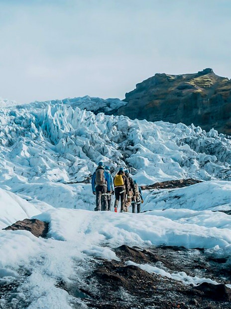 Guests exploring ice maze and glacier crevasses in Skaftafell, Iceland.