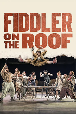 Cast performing Fiddler on the Roof in Sydney with actor leaping above table