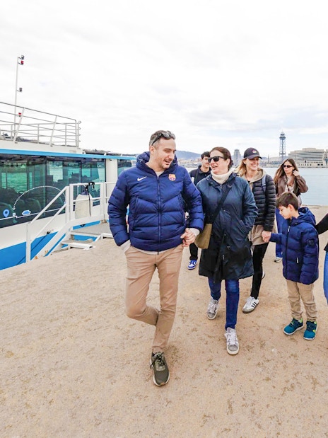 Tourists boarding Barca Sky tour at Port of Barcelona.