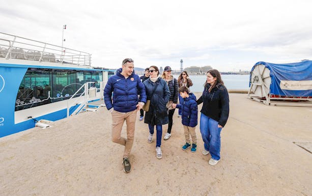 Tourists boarding Barca Sky tour at Port of Barcelona.