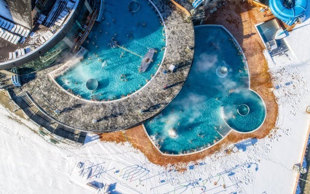 Aerial view of thermal pools in Zakopane surrounded by snow, part of Krakow day trip.