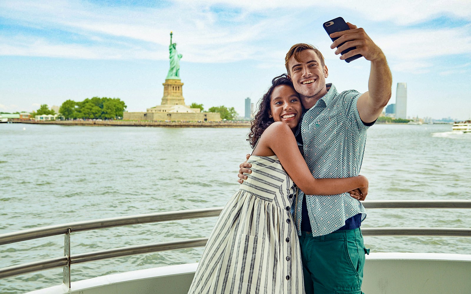 Guests clicking pictures in front of Statue of liberty during Liberty Super Express