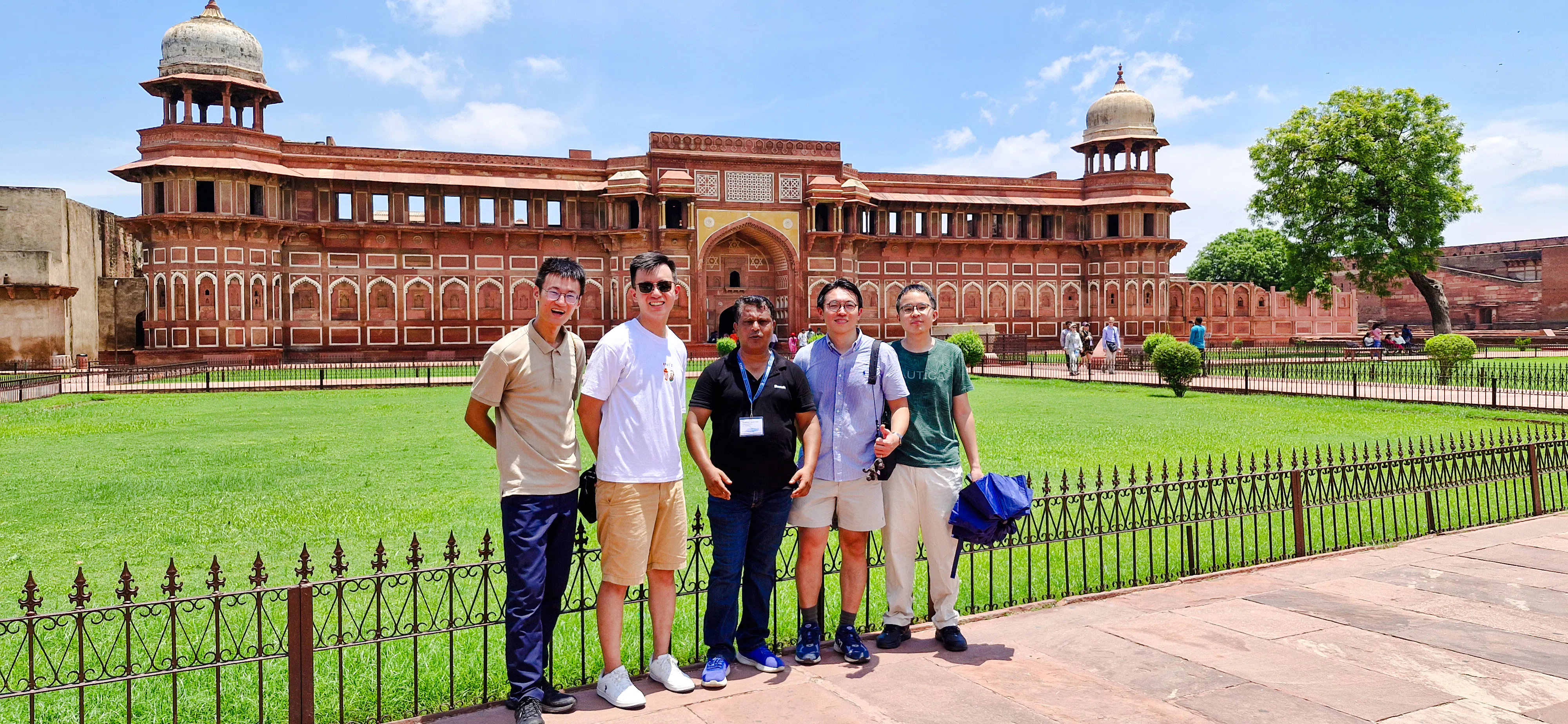 Group of tourists in front of Agra Fort during a guided day tour from Delhi.