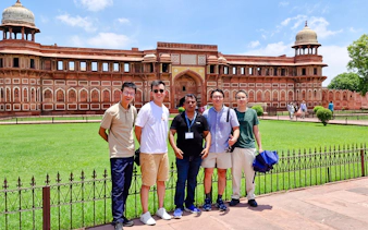 Group of tourists in front of Agra Fort during a guided day tour from Delhi.