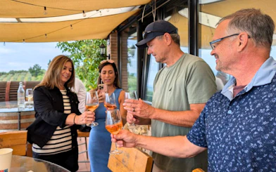 Guests enjoying wine tasting at a Tuscany winery during a private tour from Florence.