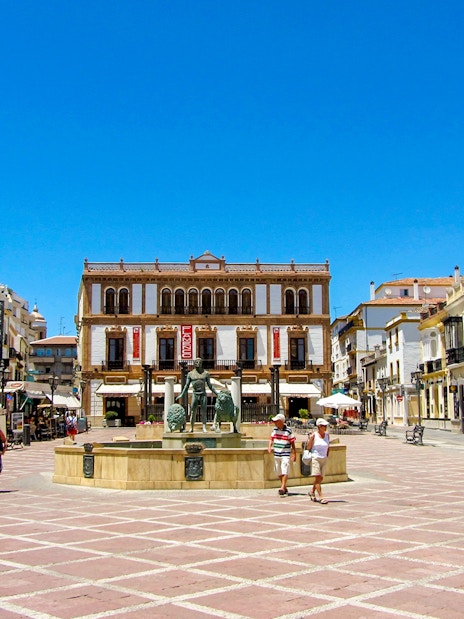 Plaza del Socorro in Ronda, Andalusia, featuring a central fountain and historic buildings.