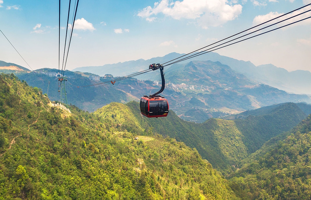 Fancipan Cable Car over lush green mountains in Sapa, Vietnam.