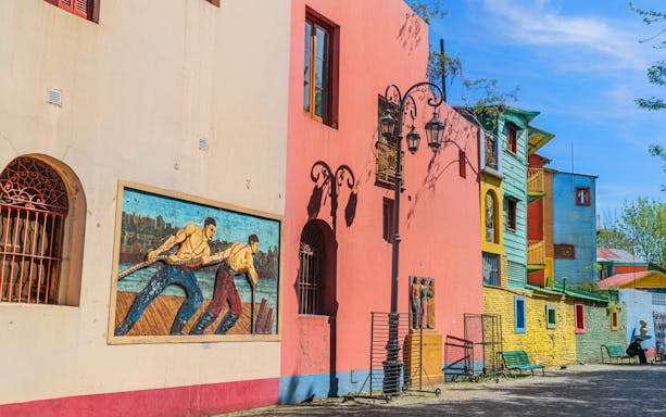 Colourful buildings and murals on La Boca walking tour in Buenos Aires.