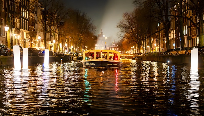 Amsterdam canal boat during Light Festival evening cruise.