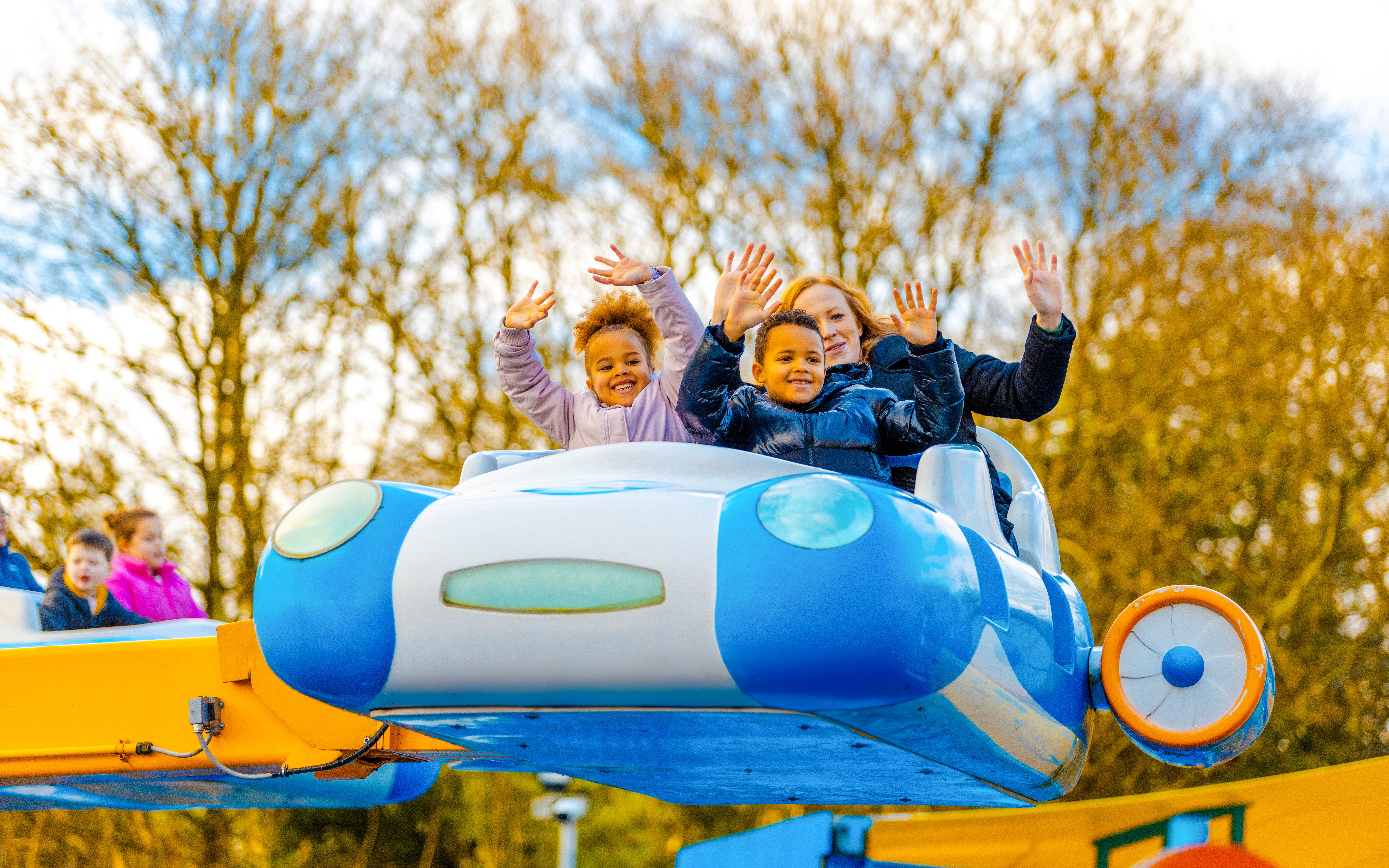 Children enjoying a ride at Alton Towers during Christmas festivities.