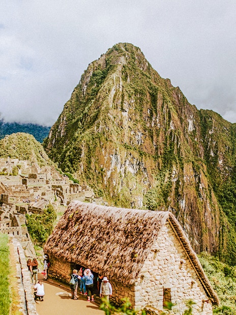 Machu Picchu ruins with Huayna Picchu mountain in the background, Peru.