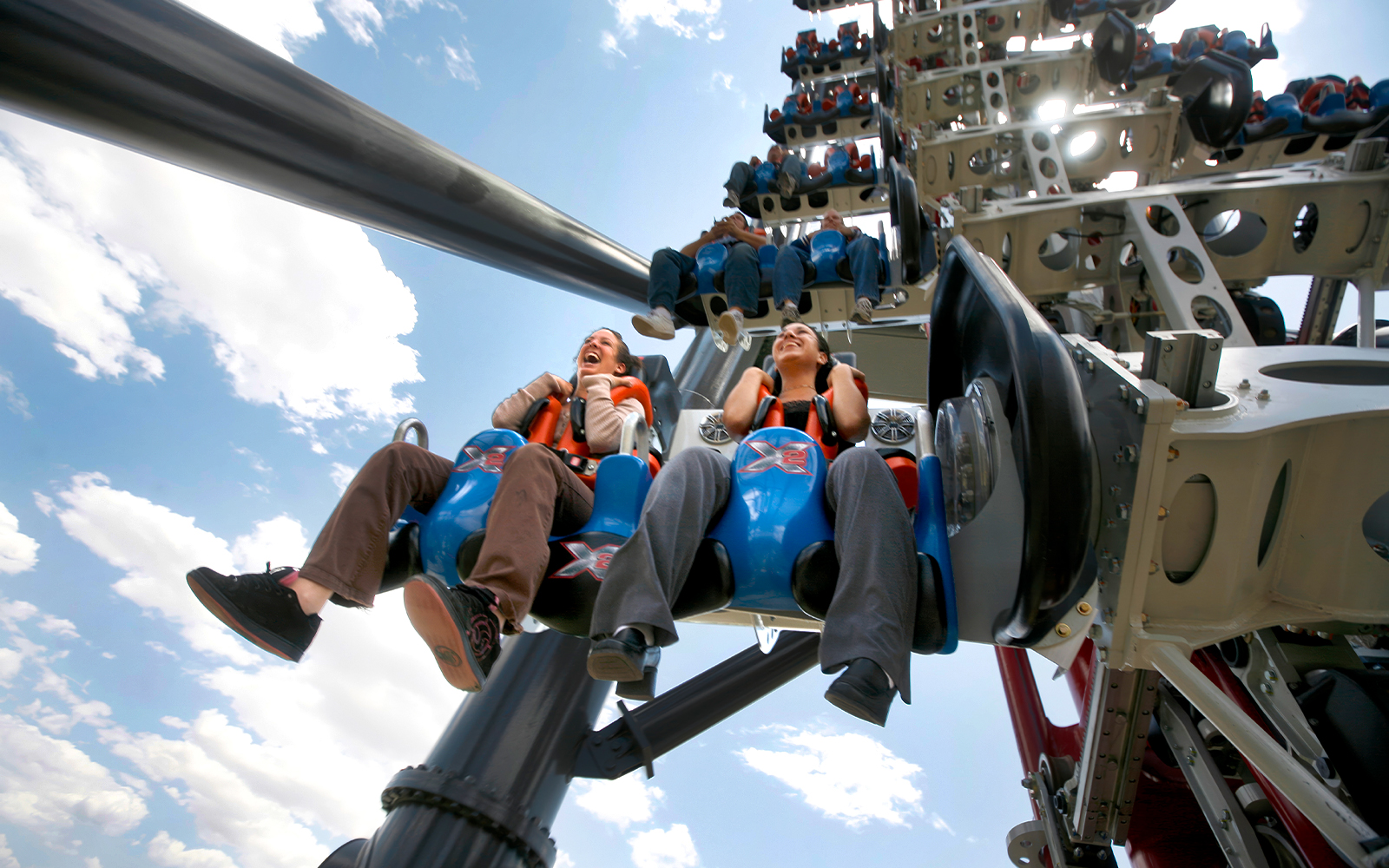 Riders on X2 rollercoaster at Six Flags Magic Mountain, California.