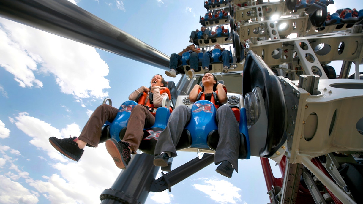Riders on X2 rollercoaster at Six Flags Magic Mountain, California.