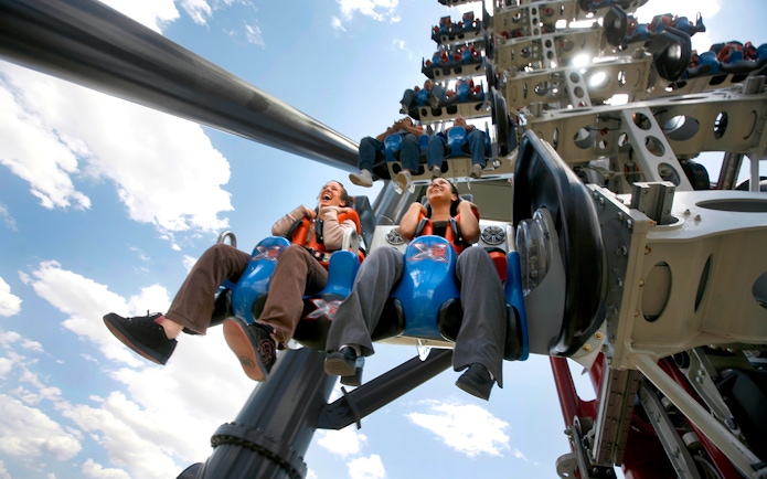 Riders on X2 rollercoaster at Six Flags Magic Mountain, California.