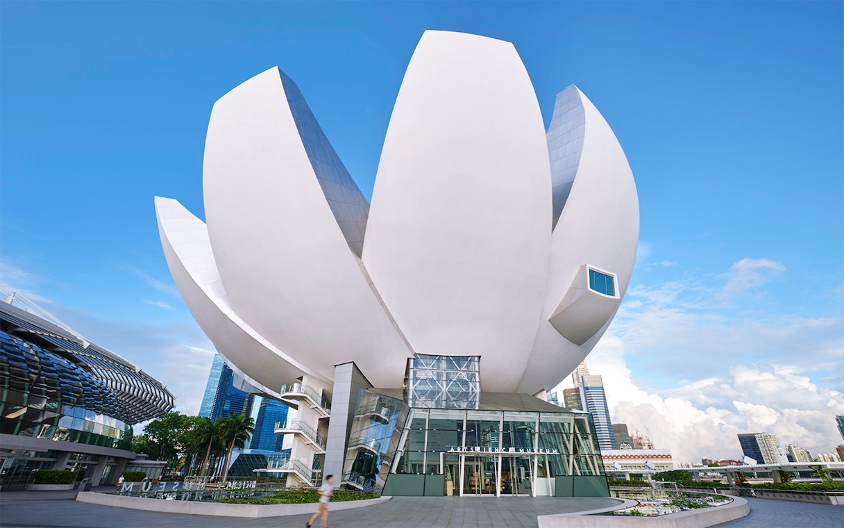 ArtScience Museum exterior in Singapore, featuring lotus-inspired architecture under a clear blue sky.