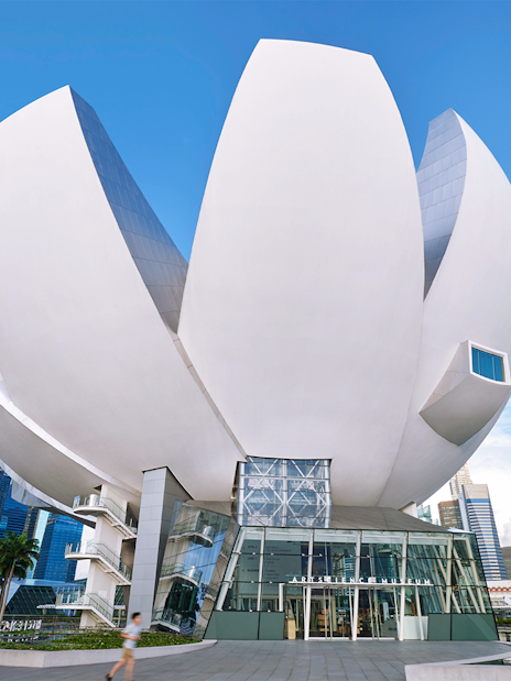 ArtScience Museum exterior in Singapore, featuring lotus-inspired architecture under a clear blue sky.
