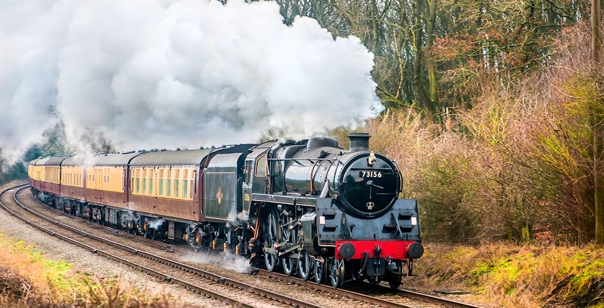 Steam engine on the Great Western Railway, Skunk Train tour through forest.