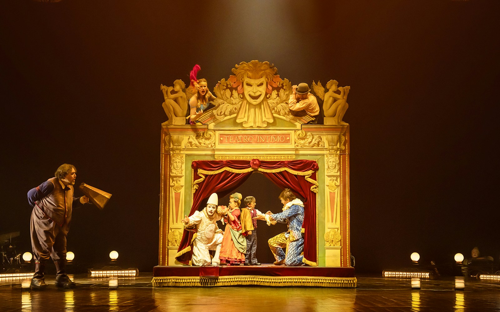 Performers on stage at Cirque du Soleil: Corteo, with ornate theater backdrop.